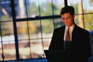 Businessman Typing on Laptop