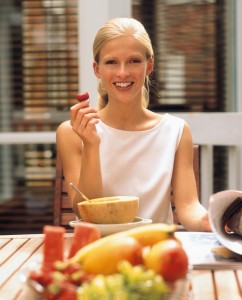 Woman Eating Fruit Outdoors